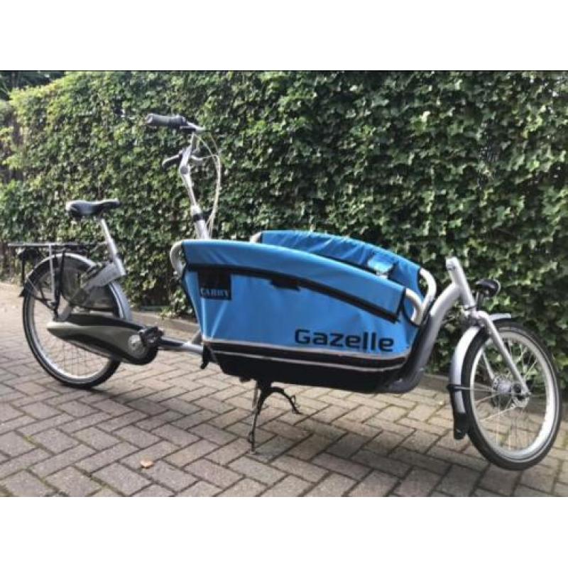 Cabby gazelle bakfiets met accessoires regenhoes zitje